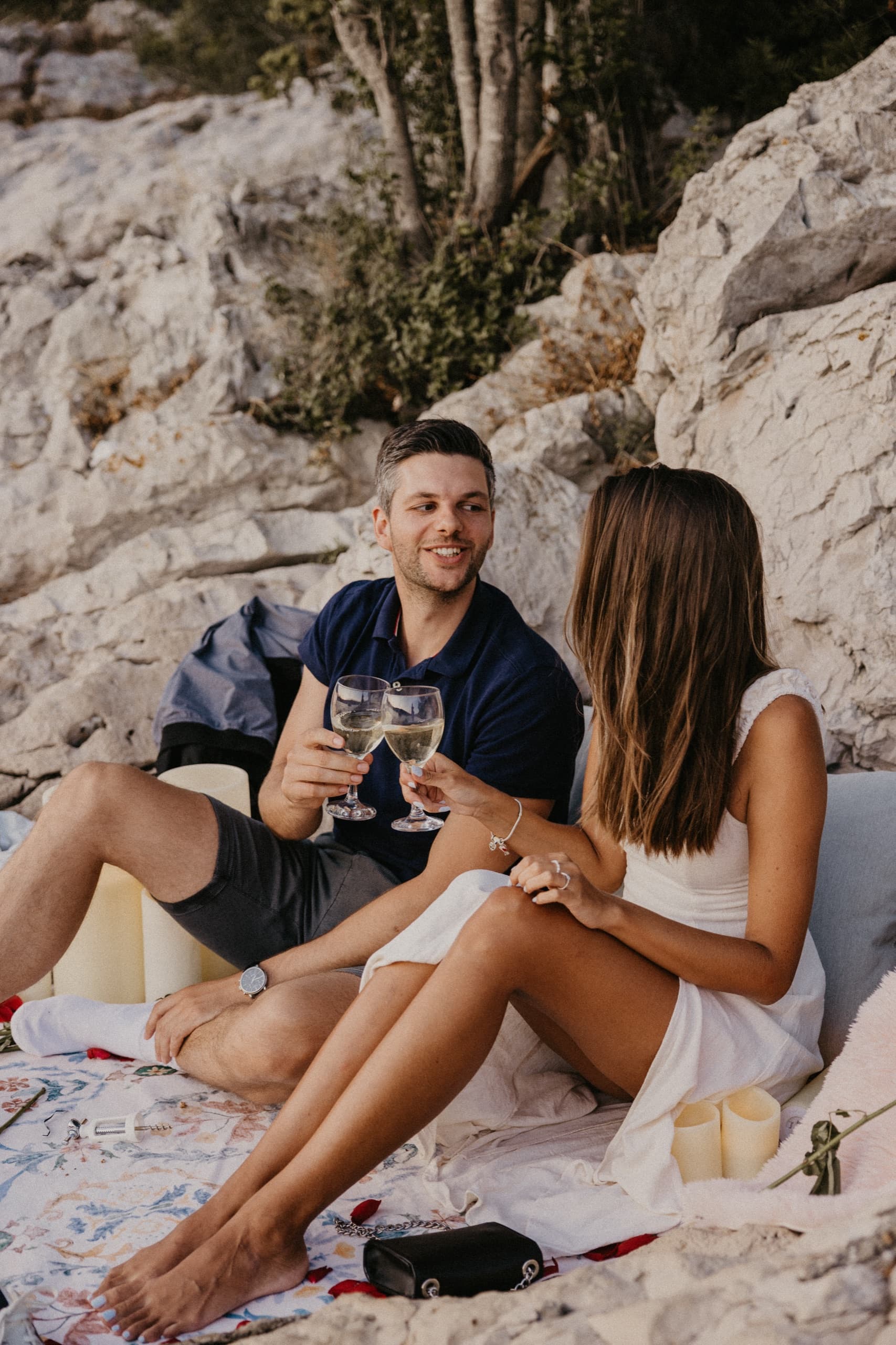 A couple standing together on the shoreline